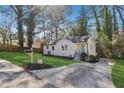 Cozy one-story home with a well-manicured lawn, landscaping, and a paved driveway for off-street parking at 2740 Dale Creek Nw Dr, Atlanta, GA 30318