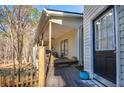 Cozy back porch featuring a wooden deck and railings at 8245 Mill Run Trl, Whitesburg, GA 30185