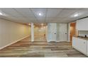 Finished basement area with recessed lighting, plank flooring, and a sink at 225 Powder Creek Dr, Dallas, GA 30157