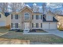 Attractive two-story house with a stone facade, black shutters, and a double garage at 5043 Laythan Jace Ct, Snellville, GA 30039