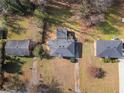 Aerial view of a home and neighborhood showing the layout of properties and surrounding greenery in a suburban setting at 1931 Selwyn Dr, Decatur, GA 30035