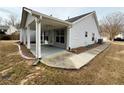 Covered patio with ceiling fans, concrete flooring, and view of the backyard at 1854 Brittlebank Ln, Lawrenceville, GA 30043