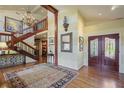 Grand foyer featuring hardwood floors, staircase, chandelier, and elegant entryway at 4084 Columns Dr, Marietta, GA 30067