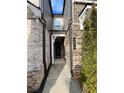 Exterior front entry featuring brick facade, modern address numbers and minimal landscaping at 3615 Faulkner St, Cumming, GA 30041