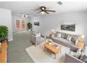 Bright, modern living room with neutral tones, plush seating, and ample natural light at 5920 Rock Rd, Union City, GA 30291