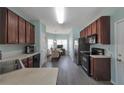 Well-equipped kitchen featuring stainless steel appliances, and dark wood cabinetry at 2555 Flat Shoals Rd # 1705, Atlanta, GA 30349