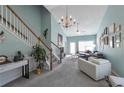 Inviting living room with vaulted ceilings, a decorative chandelier, and natural light at 2555 Flat Shoals Rd # 1705, Atlanta, GA 30349