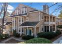 Charming exterior featuring a screened in porch and neatly trimmed landscaping at 6420 Magnolia Way, Morrow, GA 30260