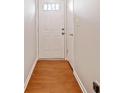 Bright hallway featuring fresh paint, modern flooring, and a clean, minimalist design at 6420 Magnolia Way, Morrow, GA 30260