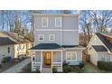Beautiful home with a covered front porch, and complementing exterior colors at 1557 Alder Se Ct, Atlanta, GA 30317