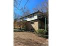 Exterior shot of the back side of a home featuring a deck at 3412 Sherrod Sw Dr, Marietta, GA 30060