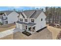 Traditional two-story home with a two-car garage and covered front porch at 18 Village Trce, Rydal, GA 30171