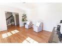 Cozy living room featuring hardwood floors, neutral paint, and comfortable seating at 1030 Laurel Valley Sw Dr, Marietta, GA 30064