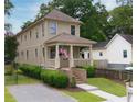 Charming two-story home with a welcoming front porch and well-maintained landscaping at 301 Fortune St, Atlanta, GA 30312