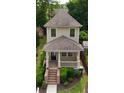 Overhead view of a charming two-story home featuring a inviting front porch and well-manicured landscaping at 301 Fortune St, Atlanta, GA 30312