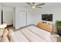 Comfortable bedroom featuring a ceiling fan, closet, and a serene ambiance at 31 Mariner Se Way, Acworth, GA 30102