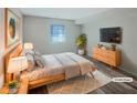 Serene main bedroom featuring a cozy bed, soft lighting, and a decorative rug, creating a peaceful retreat at 2725 Saint Augustine Se Trl, Marietta, GA 30067