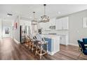 Beautiful kitchen with stainless steel appliances, large island, and stylish barstools at 442 Payne Rd, Woodstock, GA 30188