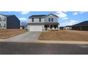 View of the home's exterior, showcasing its well-manicured lawn and the attached one car garage at 608 Tudor St, Euharlee, GA 30145