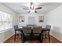 Elegant dining room with modern furnishings, natural light, and hardwood floors at 4149 Indian Lake Cir, Stone Mountain, GA 30083