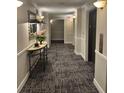 Hallway featuring patterned carpet, modern lighting, and an elevator bank at 795 Hammond Dr # 1904, Atlanta, GA 30328