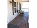 Cozy front porch features a rocking chair, creating a relaxing outdoor space with wood flooring at 2031 Lakewood Cir, Grayson, GA 30017