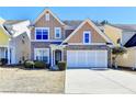 Attractive two-story home with a brick facade and a spacious two-car garage at 2157 Staunton Dr, Duluth, GA 30096