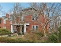 Attractive brick two-story home with mature landscaping and inviting front porch at 1241 Briarcliff Rd, Atlanta, GA 30306