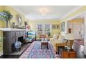 Cozy living room with a brick fireplace, crown molding, and elegant decor at 1241 Briarcliff Rd, Atlanta, GA 30306