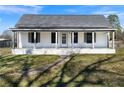 Inviting home with a covered porch, providing a welcoming entrance to the property at 62 E Georgia Ave, Emerson, GA 30137