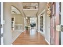 Bright foyer showcasing hardwood floors and open floor plan leading into the living spaces at 2837 Captain Ct, Dacula, GA 30019