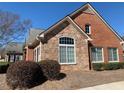 Beautiful brick and stone home with a large arched window, offering great curb appeal at 1404 Haven Cir, Douglasville, GA 30135