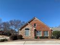 Attractive brick and stone home featuring a combination of brick and stone materials at 1404 Haven Cir, Douglasville, GA 30135