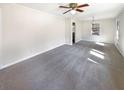 Spacious living room features carpeted floors, neutral walls, and natural light at 4227 Pine Cir, Forest Park, GA 30297