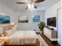 Bedroom featuring hardwood floors, a comfortable bed, and soft, neutral decor at 1376 Cornwall Rd, Decatur, GA 30032