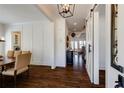 Elegant hallway featuring hardwood floors, a modern light fixture, and barn door entrance at 1537 Harts Mill Ne Rd, Brookhaven, GA 30319