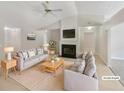 Bright living room featuring a fireplace, vaulted ceiling, and neutral decor, virtually staged at 2545 Lakemeadow Ln, Grayson, GA 30017