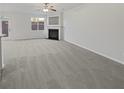 Spacious living room with fireplace and ample natural light ready for furnishing at 7088 Blairs View Dr # 4, Austell, GA 30168