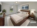 Staged main bedroom with a cozy rug, TV, and modern decor at 7088 Blairs View Dr # 4, Austell, GA 30168