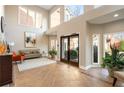 A spacious, light-filled lobby features tiled floors, a sitting area and large windows at 5300 Brooke Ridge Dr, Dunwoody, GA 30338
