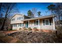 Charming two-story home with siding, well-manicured lawn, and welcoming front porch at 940 Highview Se Dr, Smyrna, GA 30082