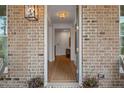 Inviting entryway with hardwood floors, stylish lighting, and a welcoming ambiance at 1004 Baldwin Dr, Milton, GA 30009