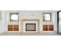 Close up of the living room fireplace with unfinished wood frame and built-in shelving at 2369 Drew Valley Ne Rd, Atlanta, GA 30319