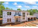 Modern home under construction featuring wrap and framing, ready for finishing touches at 4238 Hamilton Mill Rd, Buford, GA 30519