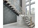 Bright interior shot featuring a staircase with glass railing and decorative wall paneling at 4238 Hamilton Mill Rd, Buford, GA 30519