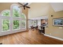 Bright living room features hardwood floors, cathedral ceilings and breakfast bar at 625 Jefferson Pl, Cumming, GA 30040