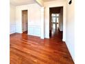 Bright dining area with hardwood flooring and classic white wainscoting detail at 3476 Harvest Ridge Ln, Buford, GA 30519