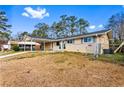 Attractive ranch-style home featuring a covered carport and fenced yard at 1646 Flicker Rd, Jonesboro, GA 30238
