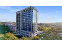 Modern high-rise building showcasing multiple balconies and a rooftop terrace at 2233 Peachtree Ne Rd # 402, Atlanta, GA 30309