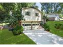 Charming home with a two-car garage, brick and siding accents, and a well-maintained front lawn at 4883 Rock Haven Dr, Lilburn, GA 30047